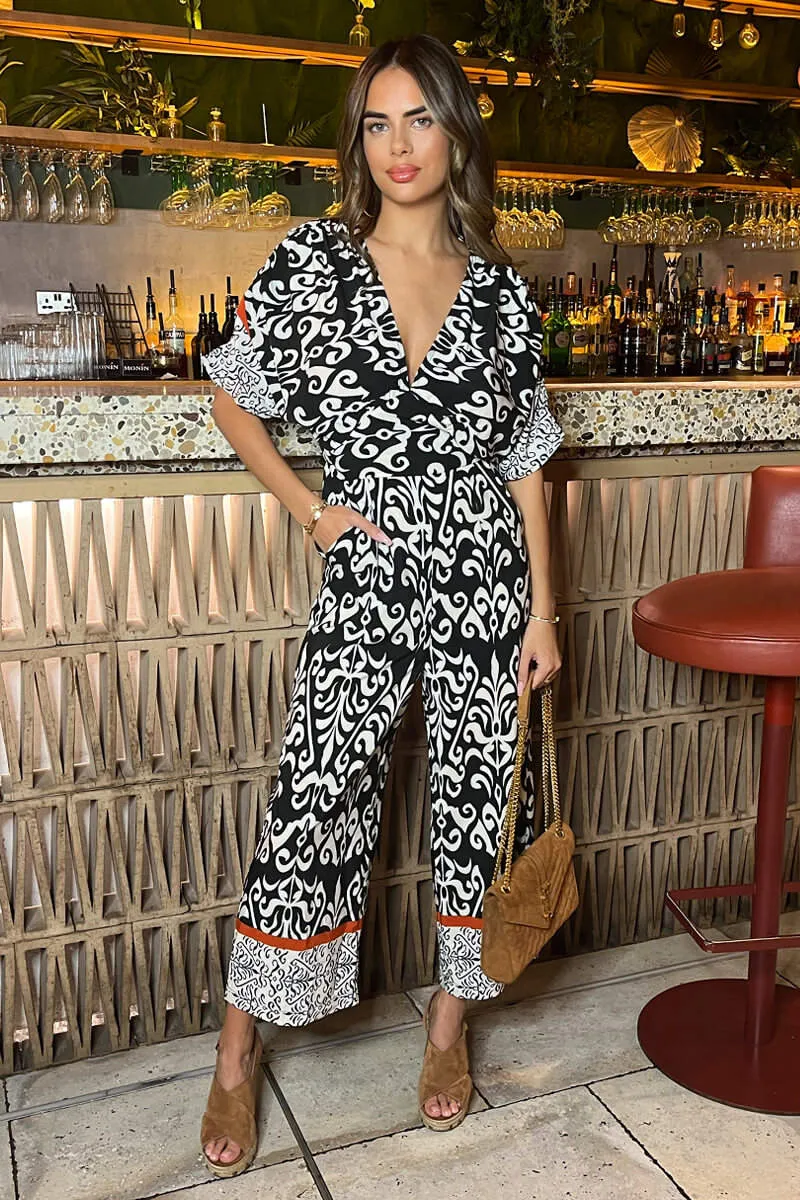 AX PARIS BLACK AND CREAM V-NECK JUMPSUIT