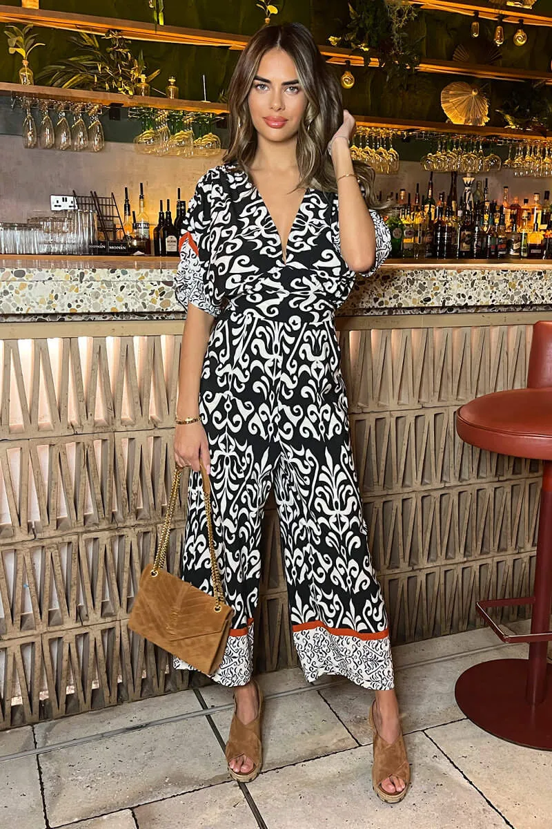 AX PARIS BLACK AND CREAM V-NECK JUMPSUIT